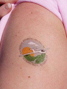 Pam shows off her National Soaring Museum tattoo